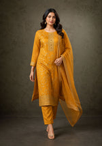 SN119 women’s mustard gold embroidered kurta set with dupatta, long sleeve round neck walking pose