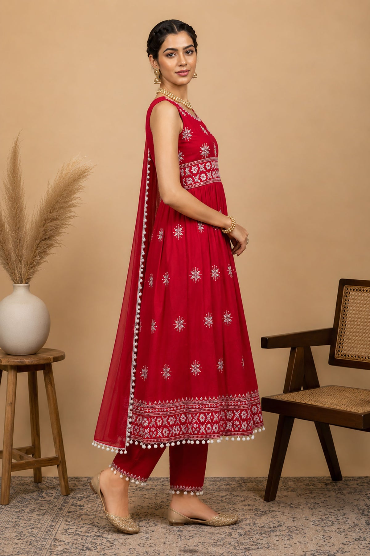 SN120 women’s red sleeveless kurta set side pose showing flare and dupatta drape