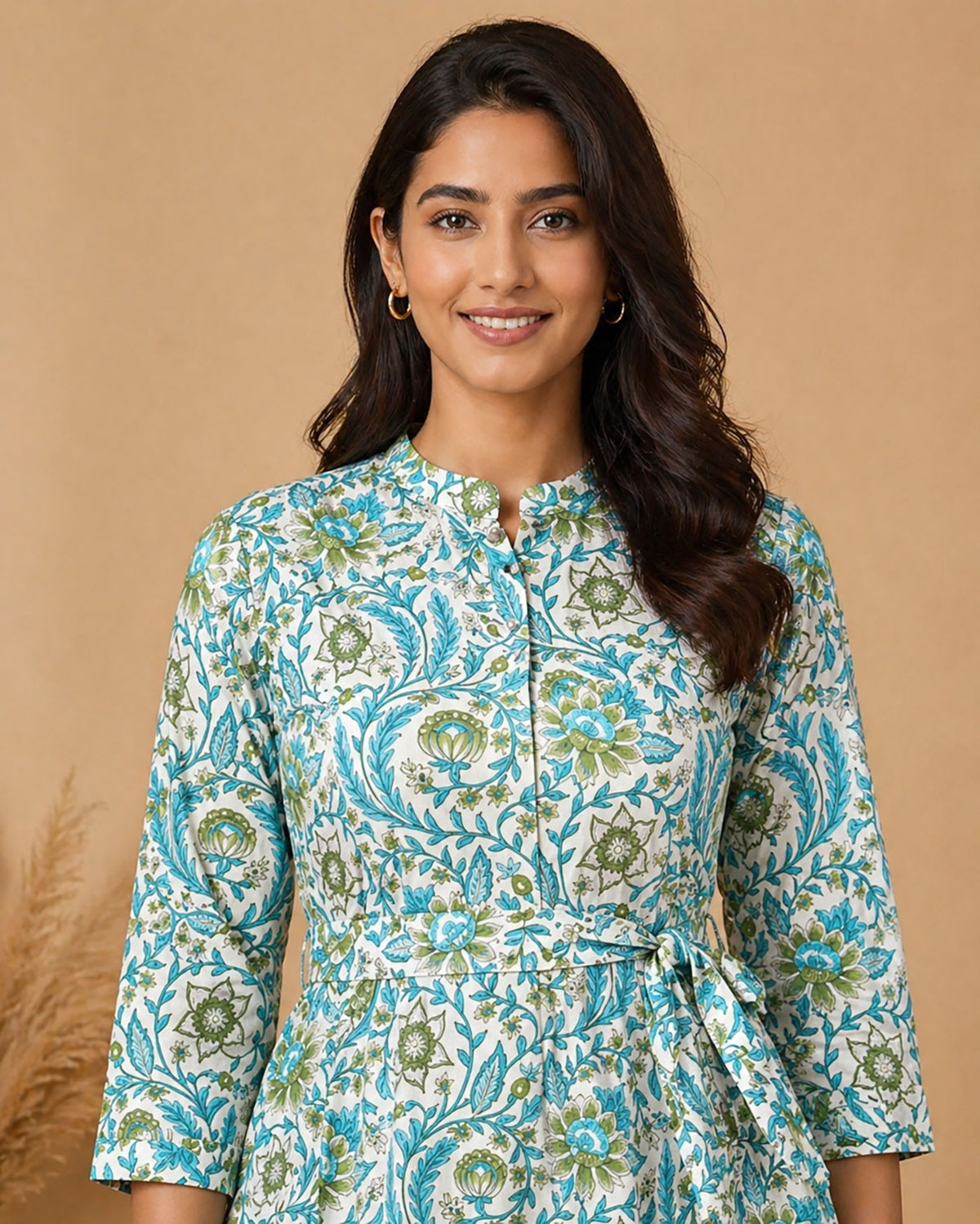 Closeup view of turquoise teal botanical vine print dress showing mandarin collar, fine stitching and crisp fabric texture