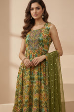 Olive green kurta set close-up showing round neckline and intricate Ikat print detailing.