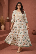 SN141 women’s ivory embroidered cotton Anarkali dress in walking pose with flared hem.