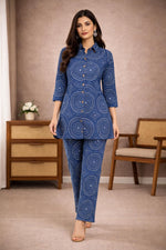 SN158 women’s indigo cotton co-ord set walking pose with long sleeves, V-neck tunic and relaxed straight pants.