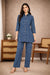 Indigo cotton co-ord set front view, A-line tunic, circular dot print, straight pants, nude block heels.