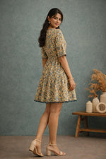 SN159 women’s butter yellow floral cotton tiered dress side view with elbow sleeves and tie waist