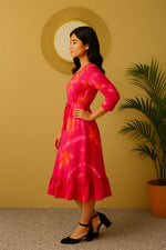 Side view of women’s pink orange tie-dye rayon midi dress with 3/4 sleeves