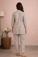 SN160 women’s ivory botanical print cotton kurta pant set back pose with straight silhouette