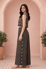 SN175 women’s black floral co-ord set side pose with sleeveless crop top and wide palazzo pants