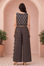 Black printed crop top and palazzo set, back view, floral vine motifs, wide-leg pants.