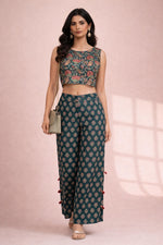 SN177 women’s teal lotus print crop top and flowy palazzo co-ord set in walking pose.