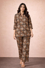SN179 women’s brown floral cotton co-ord set with long sleeves and straight pants in walking pose.