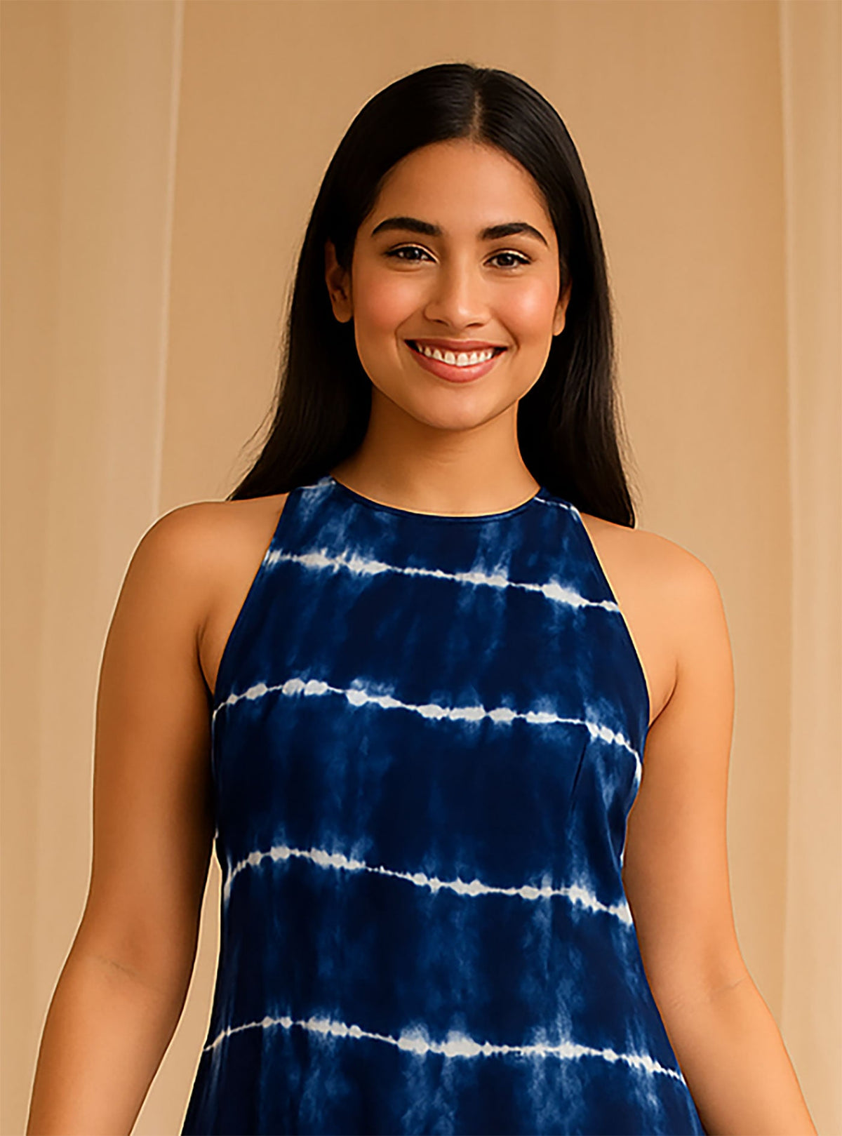 Close-up of navy blue tie-dye halter neck dress showing neckline and upper bodice detail.