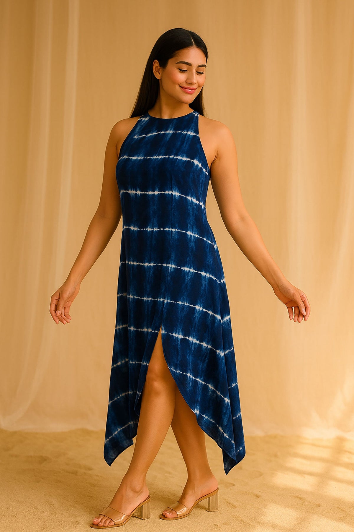 Side view of navy blue tie-dye asymmetrical midi dress with front slit and flowy hemline.