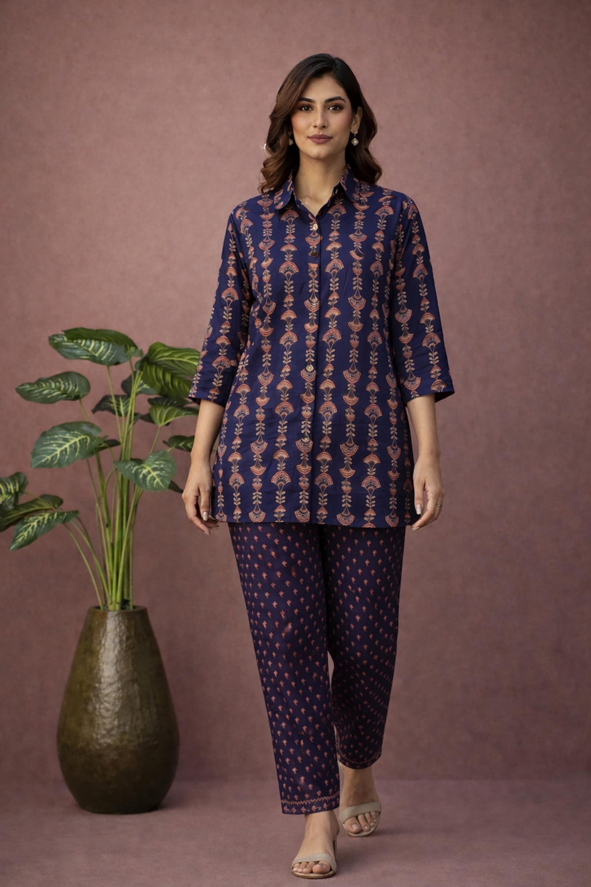 SN180 women’s indigo cotton kurta pant co-ord set walking pose with ankle-length pants and block heels