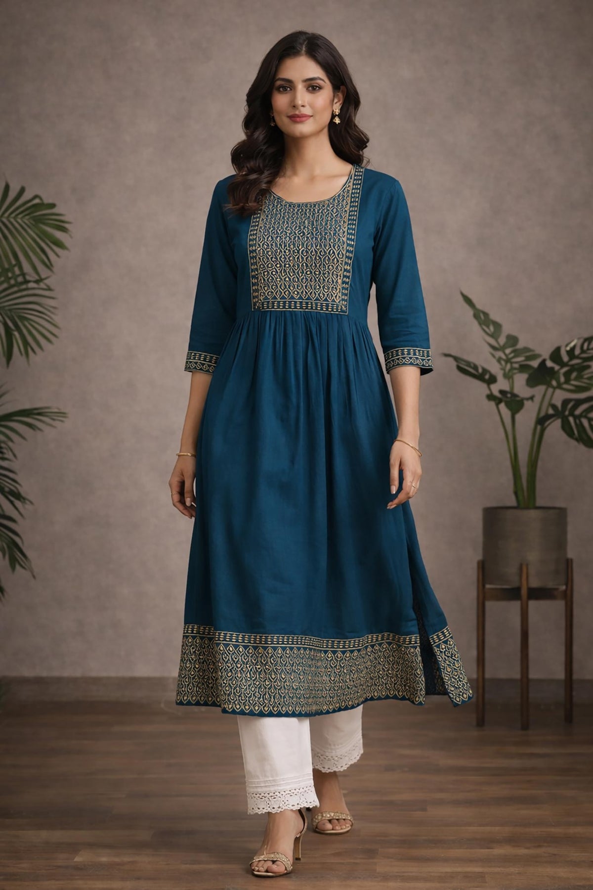 SN183 women’s teal blue embroidered cotton kurti, walking pose with flowy flare and mid-calf length