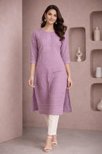 SN201 women’s lavender cotton embroidered kurti with round neck and three-quarter sleeves, walking pose with neutral heels