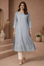 SN202 women’s dusty blue embroidered cotton kurti walking pose styled with cream pants and block heels