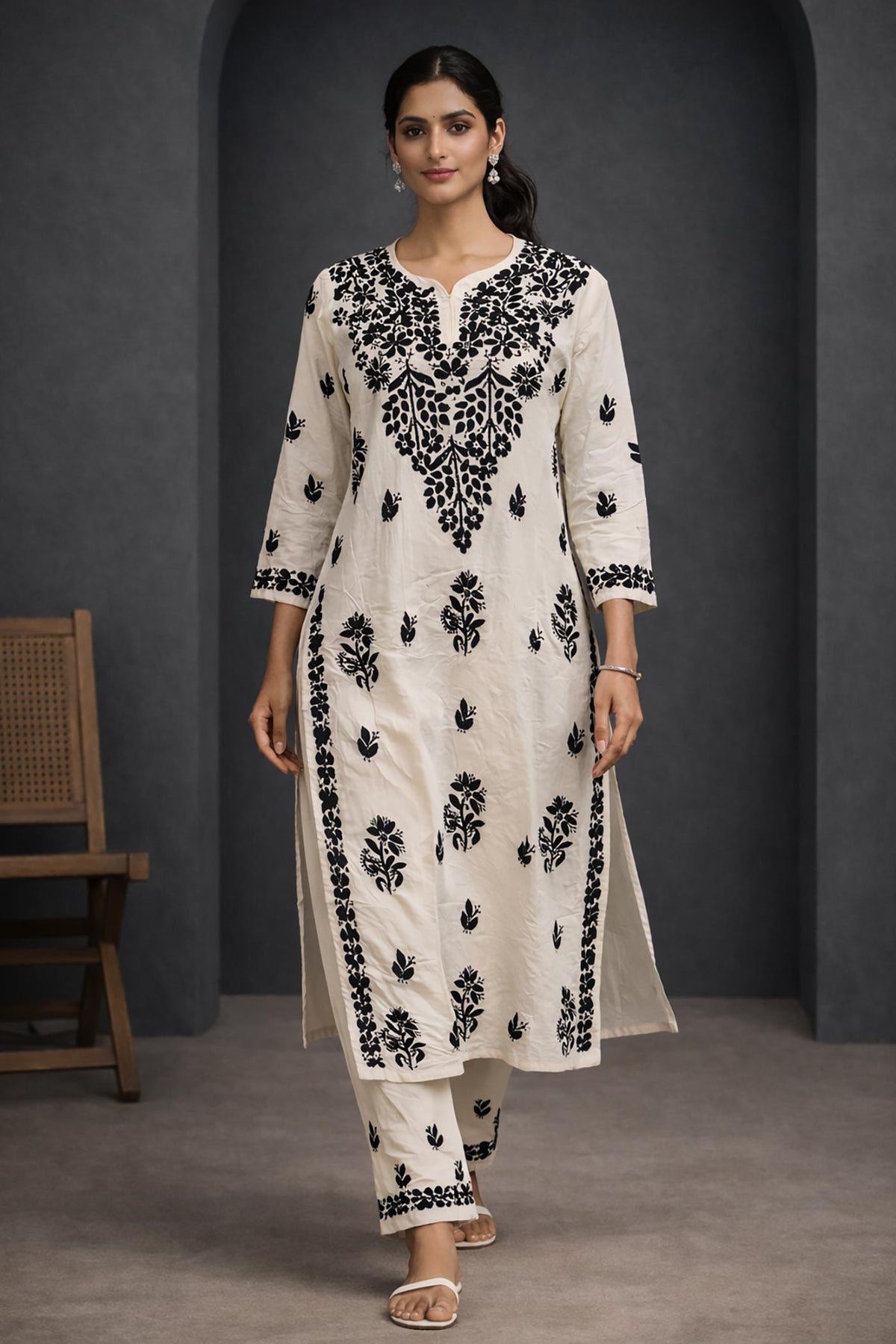 SN234 women’s ivory cotton kurta pant set with black embroidery, V-neck and three-quarter sleeves, walking pose