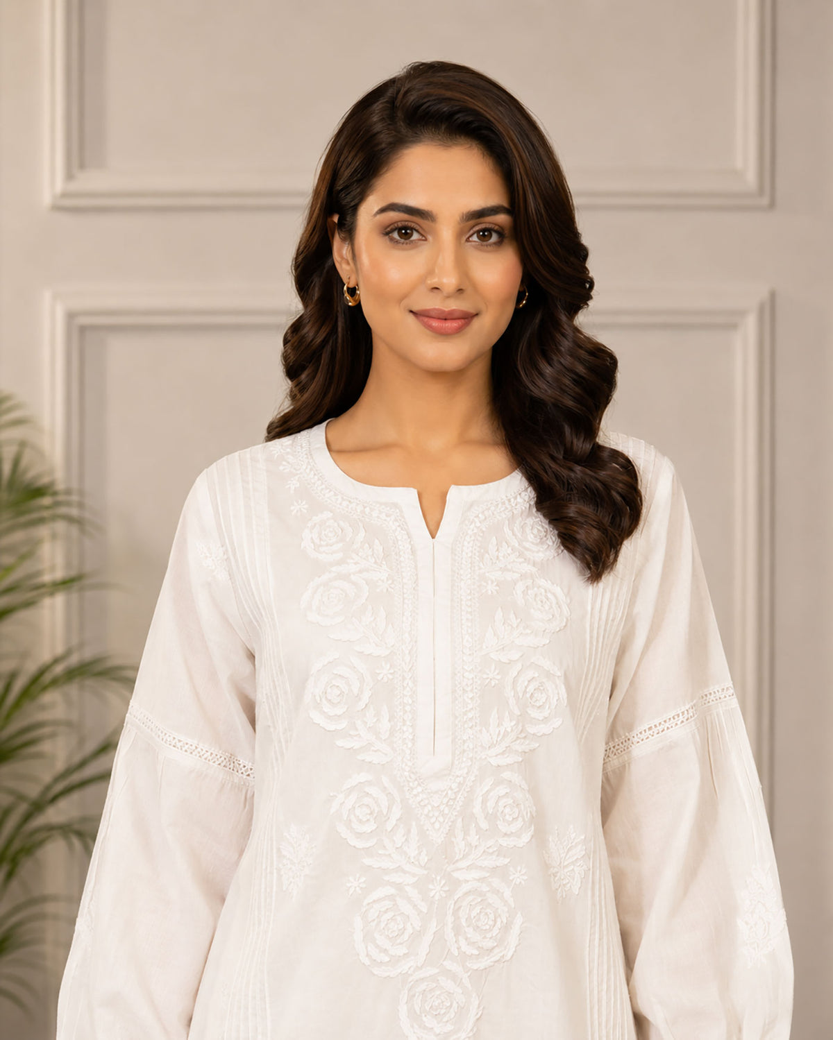 SN240 closeup of women’s ivory cotton kurta with V-slit neck, long sleeves and tonal chikankari embroidery