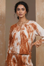 SN25 women’s rust tie-dye co-ord set closeup of long sleeve button-front top fabric and neckline