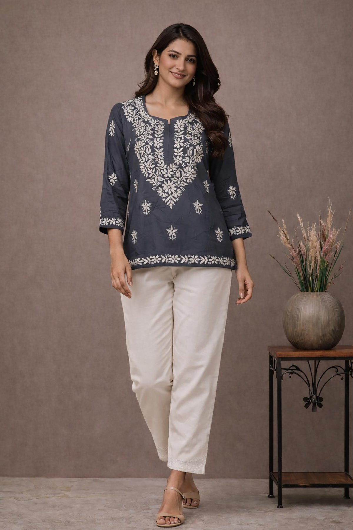 SN251 women’s slate grey cotton kurti with floral embroidery and round neck walking pose