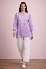 SN254 women’s lavender cotton embroidered kurti walking pose with straight fit and floral embroidery.