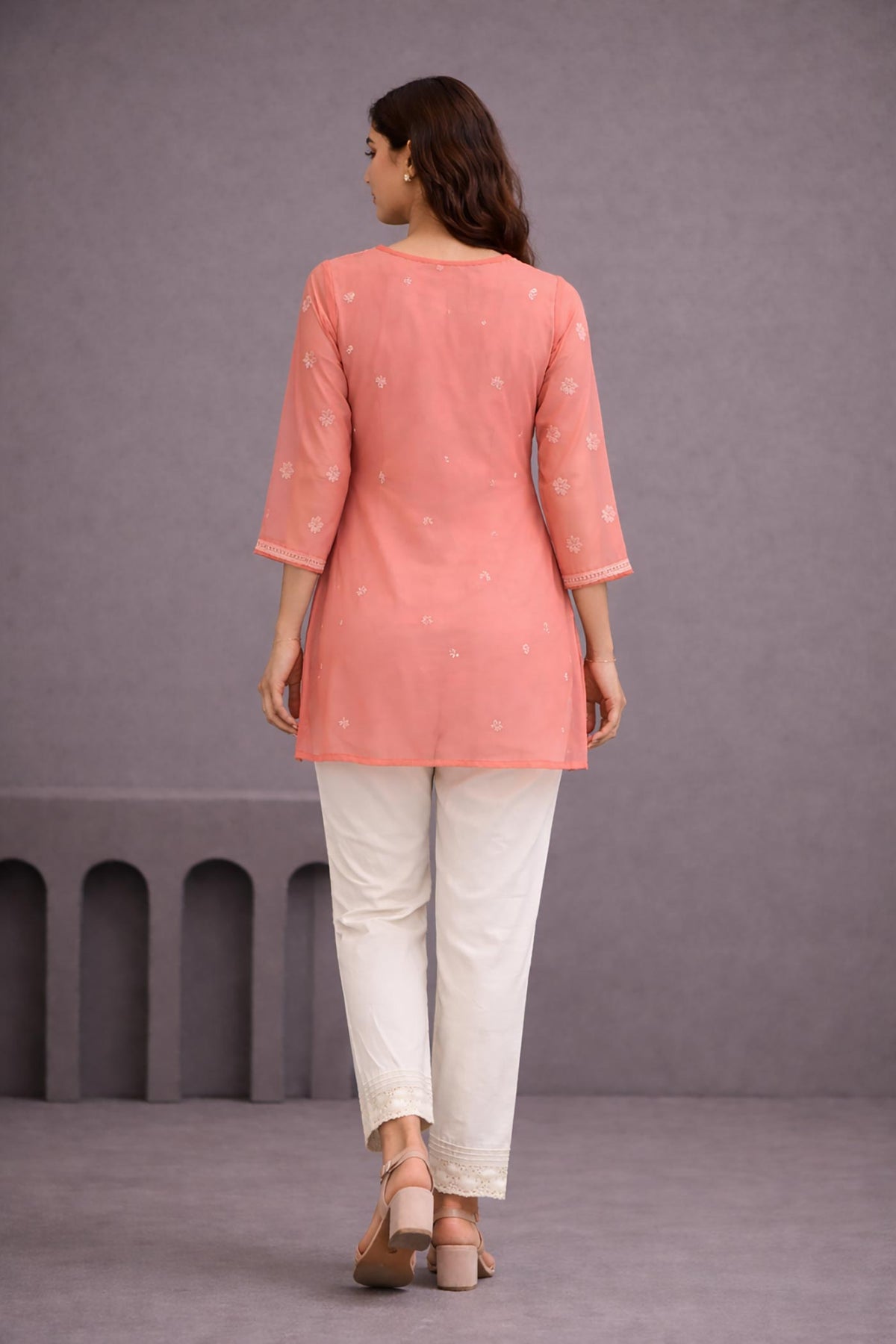 SN256 women’s coral orange organza short kurti back pose with semi A-line silhouette and sheer sleeves
