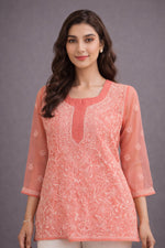 SN256 women’s coral orange organza short kurti closeup showing chikankari embroidery and rounded neckline