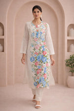 SN258 women’s ivory cotton kurta pant set walking pose with long sleeves and floral embroidered detailing