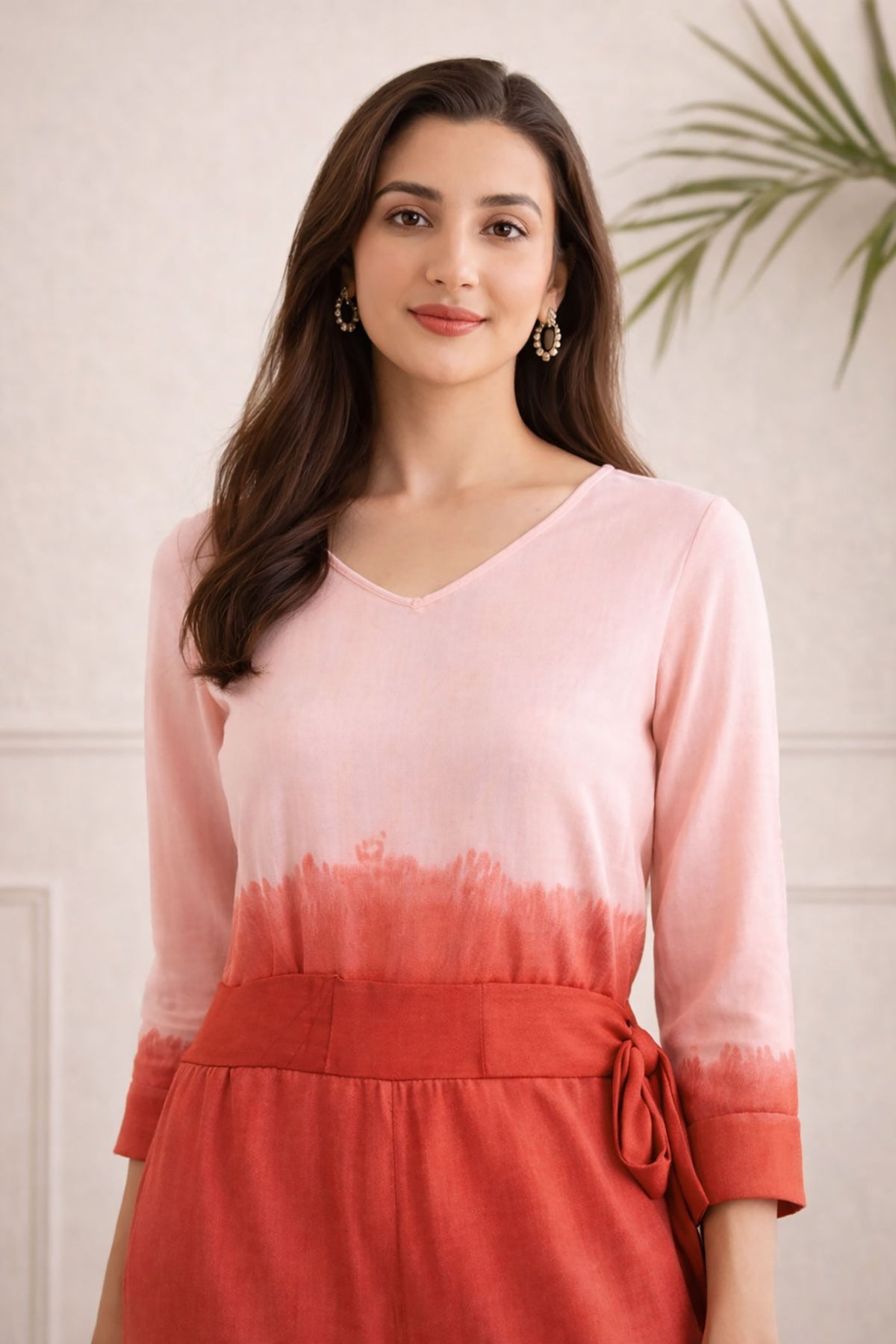 SN27 women’s ombre pink-red jumpsuit closeup showing V-neck and long sleeves