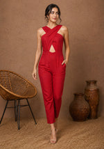 SN28 women’s red sleeveless crisscross neck jumpsuit walking pose with structured waist