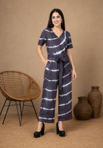 SN30 women’s black and white tie-dye V-neck jumpsuit with short sleeves and waist tie – front pose