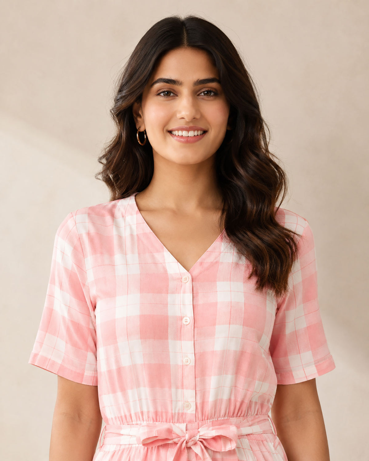 SN31 women’s pink gingham V-neck short sleeve jumpsuit with button front – closeup pose