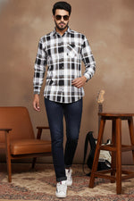 SN326 men’s black white plaid cotton blend shirt walking pose paired with dark denim and sneakers