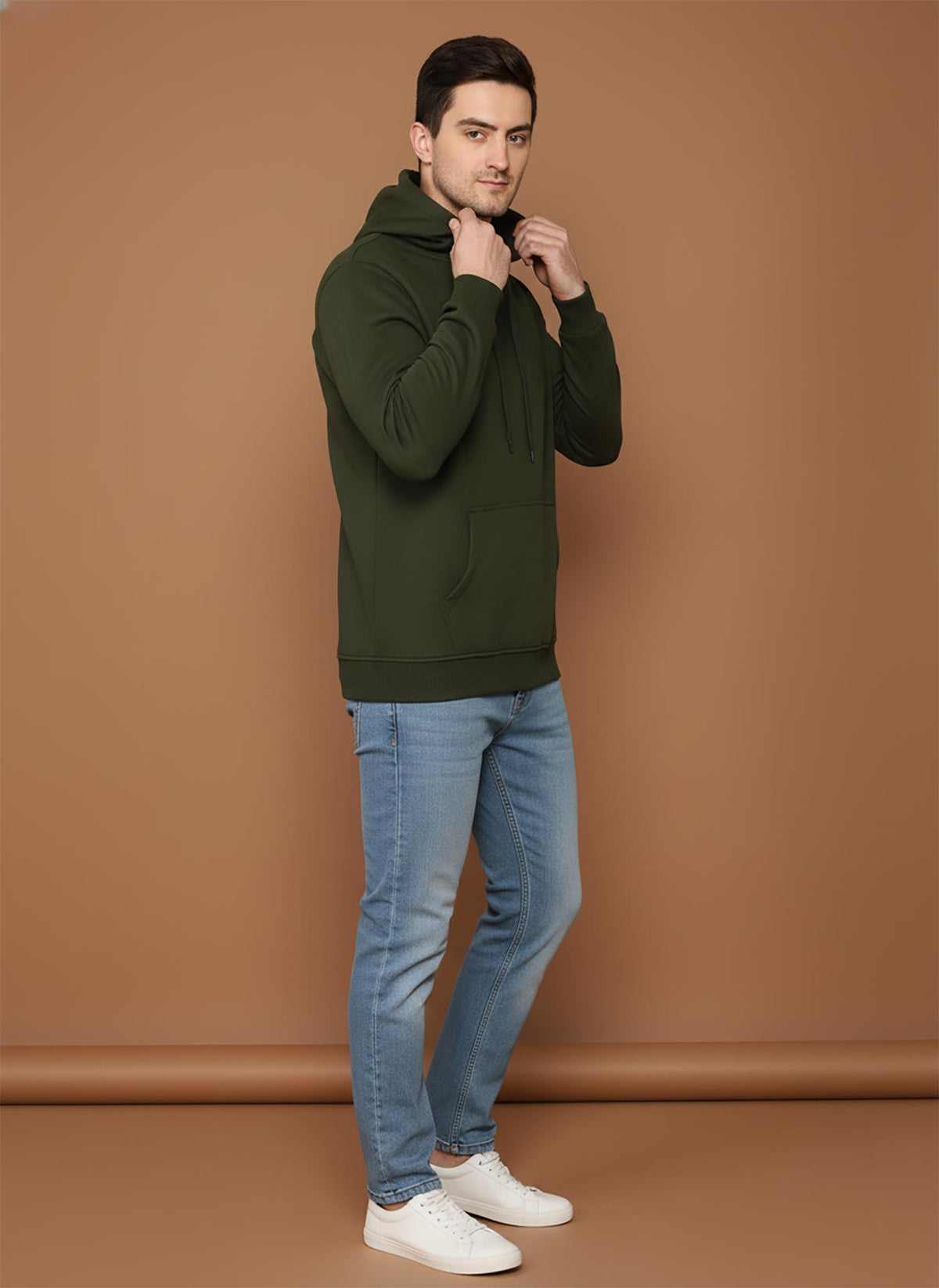 SN360 men’s olive green cotton fleece hoodie side view with long sleeves and relaxed fit paired with denim jeans