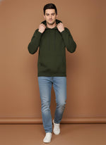 SN360 men’s olive green hoodie walking pose styled with slim fit jeans and white sneakers for casual wear