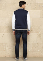 SN365 men’s navy cotton blend varsity jacket back view with white sleeves and ribbed hem detail