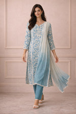 Floral printed kurta set in powder blue with straight pants and ombre dupatta, full front view.
