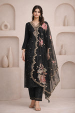 Midnight black floral embroidered kurta set front view, straight pants, sheer dupatta, neutral heels.