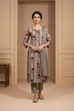 Straight taupe kurta set with maroon stripe print, matching pants, sheer dupatta, traditional flats.