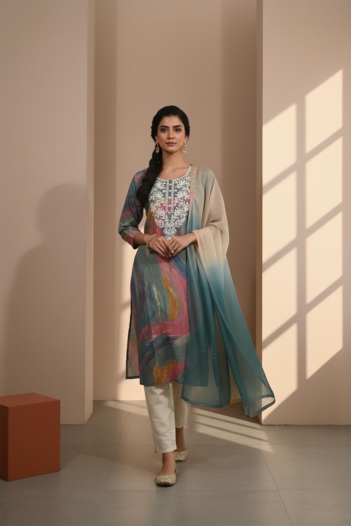 Multicolor silk-blend kurta set with embroidered neckline, ombre dupatta and ivory pants, front walking view with juttis.