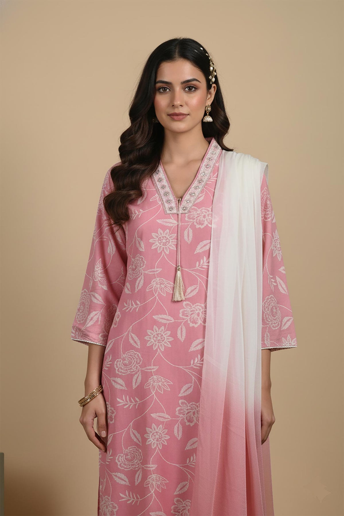 Blush pink kurta set close-up showing embroidered V-neckline, floral print, and ombre dupatta detail.