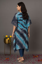 Back view of women’s blue and black tie-dye kaftan kurti with loose fit, short sleeves and asymmetrical hemline styled with jeans for casual wear