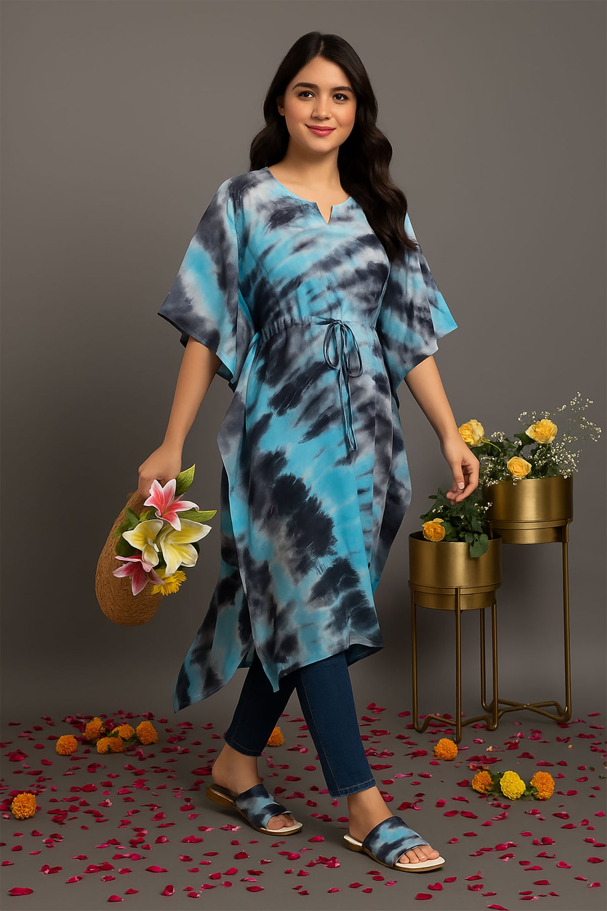 Front angle view of women’s blue and black tie-dye kaftan kurti with drawstring waist, relaxed fit and flowy hem, styled with jeans for casual everyday wear