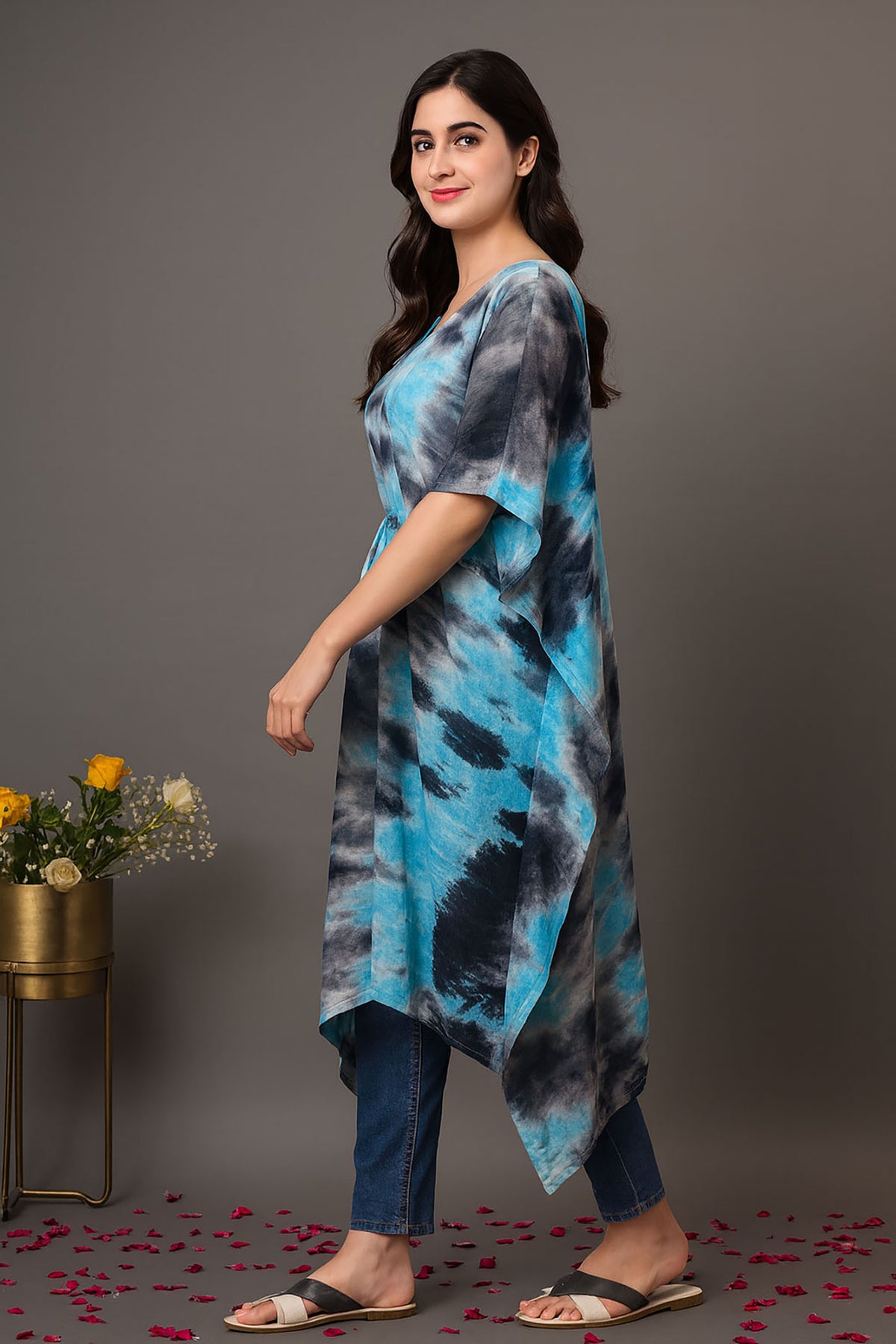 Side view of women’s blue and black tie-dye kaftan kurti with relaxed fit, short sleeves and flowing midi length, styled with jeans for casual wear