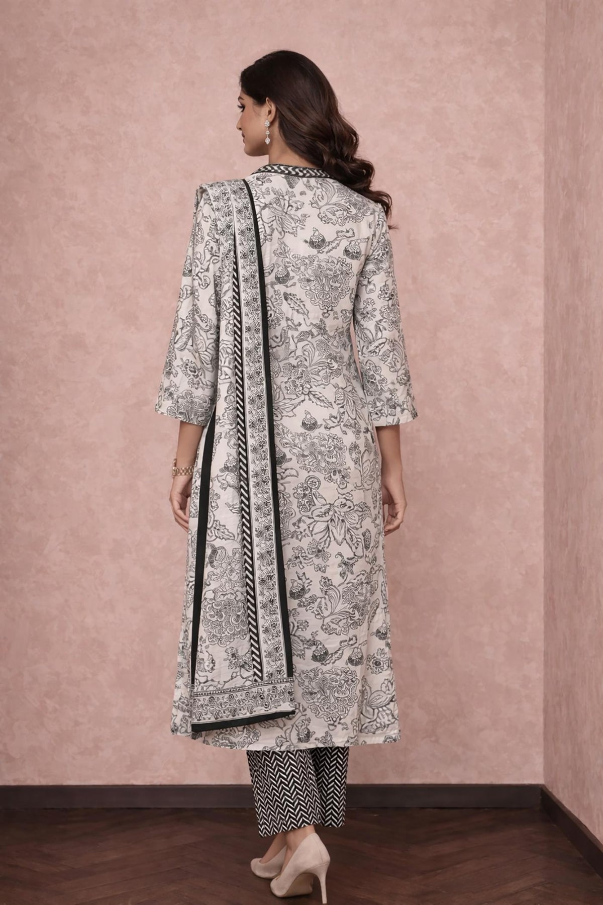 Off-white printed cotton kurta set with dupatta border detail, three-quarter sleeves, back view with heels.