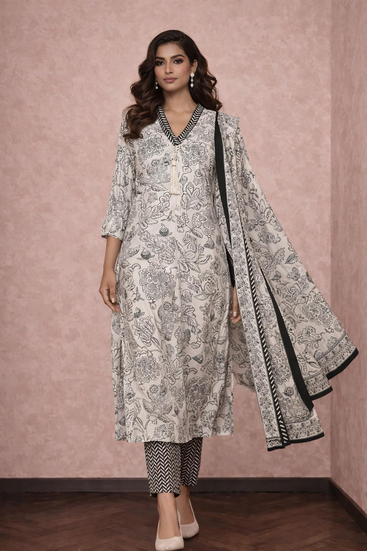 Off-white floral cotton kurta set with dupatta, straight pants and nude heels, walking front view.