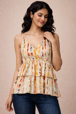 Watercolor stripe V-neck sleeveless camisole close-up showing tiered layers and soft drape.