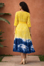 Back view of yellow and blue tie-dye cotton midi dress with waist belt and three-quarter sleeves