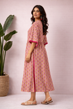 Side view of pink and mustard cotton handblock print kaftan kurti with elbow sleeves and side slit detail